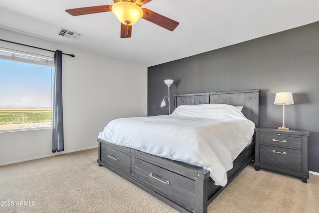 bedroom featuring visible vents, ceiling fan, light carpet, and baseboards