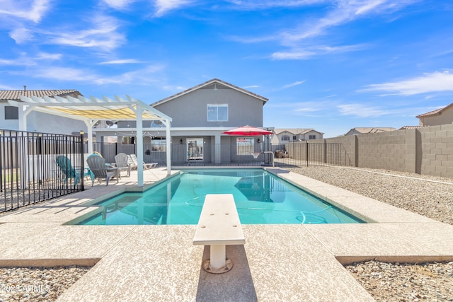 view of pool with a fenced backyard, a diving board, a fenced in pool, a pergola, and a patio area