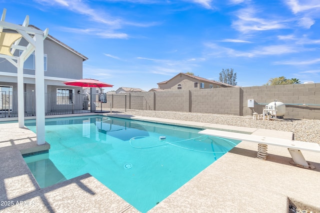 view of swimming pool featuring a fenced in pool, a fenced backyard, and a patio