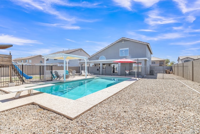 view of pool featuring a fenced backyard, a diving board, a fenced in pool, and a patio