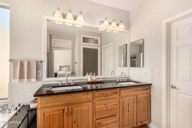 bathroom with decorative backsplash and vanity