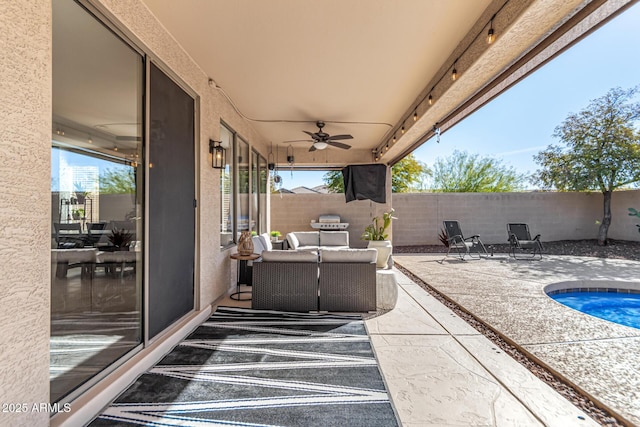 view of patio / terrace featuring ceiling fan