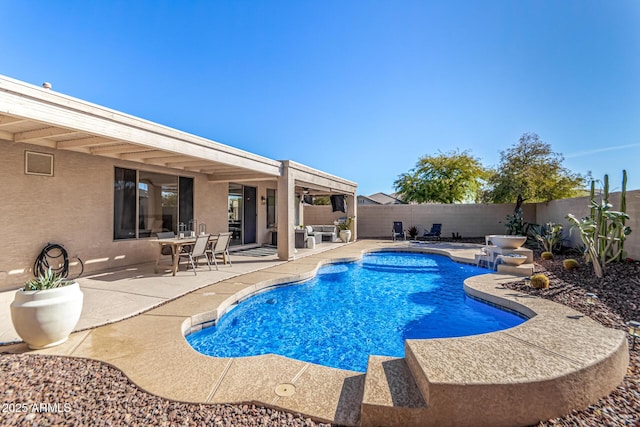 view of swimming pool with a patio