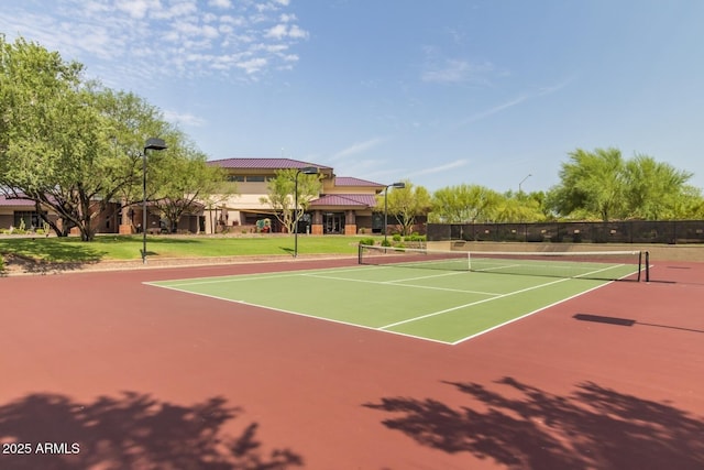 view of tennis court featuring basketball court