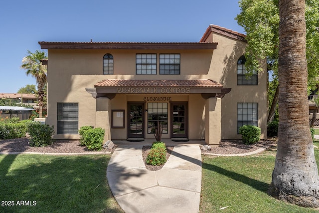 1351 N Pleasant Dr Unit 2011, Chandler, AZ 85225 - mediterranean / spanish-style home featuring a tiled roof, stucco siding, and a front yard