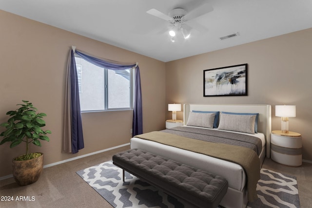 bedroom featuring ceiling fan and carpet