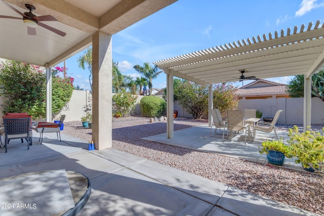 view of patio / terrace featuring ceiling fan and a pergola