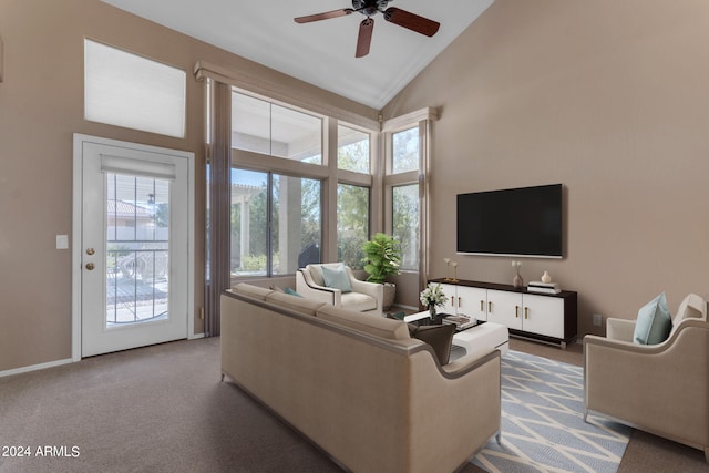 carpeted living room featuring high vaulted ceiling and ceiling fan