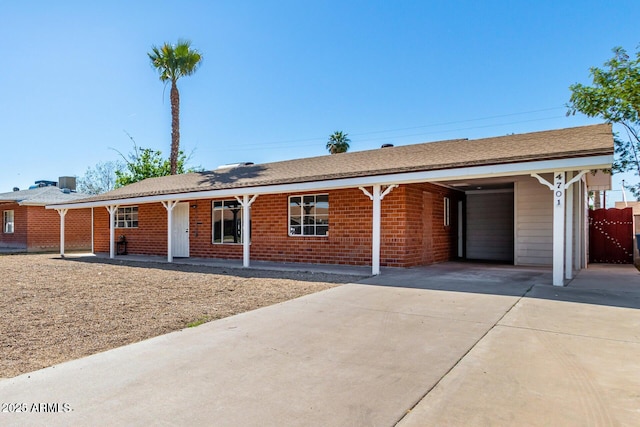 single story home featuring a carport