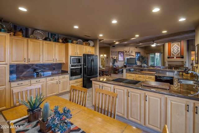 kitchen with kitchen peninsula, beamed ceiling, black appliances, backsplash, and sink