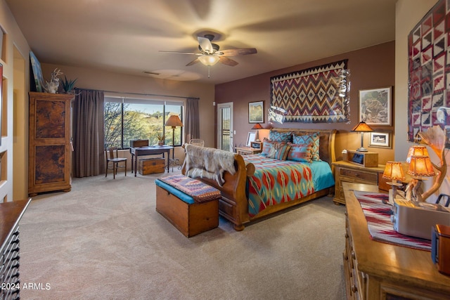 bedroom with light colored carpet and ceiling fan