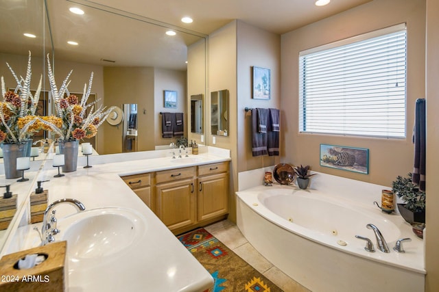 bathroom with tile floors, vanity, and a washtub