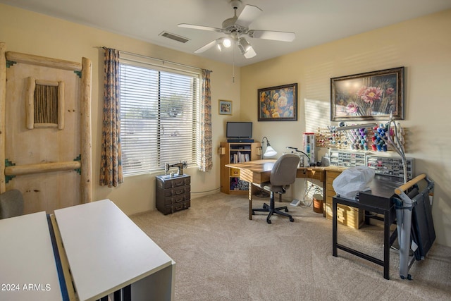 carpeted office featuring ceiling fan