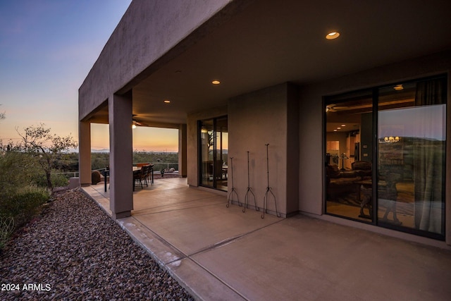 view of patio terrace at dusk