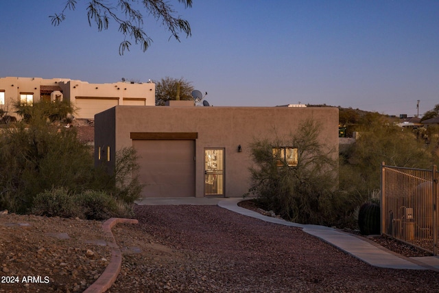 southwest-style home with a garage