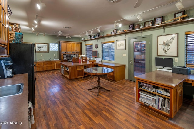 kitchen with rail lighting, ceiling fan, and dark hardwood / wood-style floors