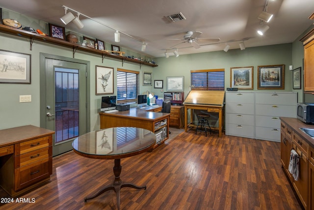 office area featuring track lighting, ceiling fan, and dark hardwood / wood-style flooring