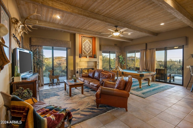 living room with light tile floors, wooden ceiling, ceiling fan, beamed ceiling, and pool table