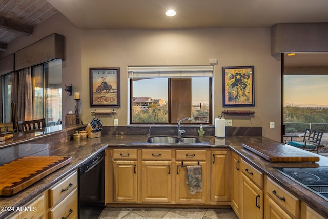 kitchen with sink, light tile floors, black appliances, and kitchen peninsula