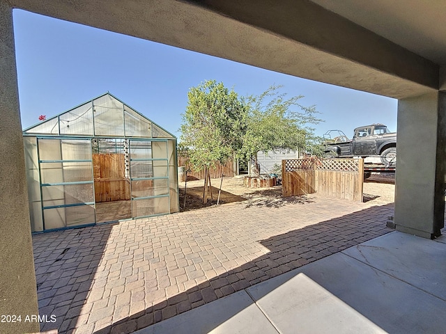 view of patio with an outdoor structure