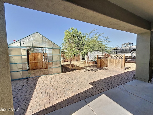 view of patio with an outdoor structure