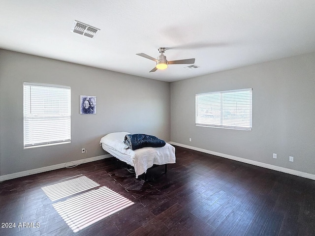 bedroom featuring dark hardwood / wood-style floors and ceiling fan