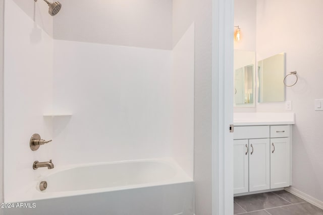 bathroom with vanity, tub / shower combination, and tile patterned floors