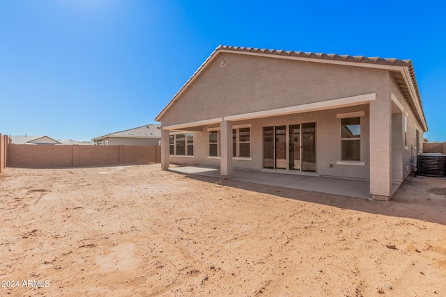 back of house featuring cooling unit and a patio