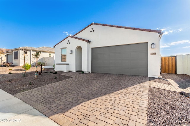 mediterranean / spanish house featuring a garage