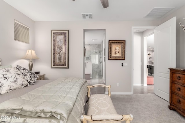 carpeted bedroom with ceiling fan and ensuite bathroom