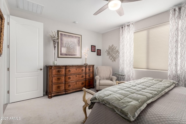 bedroom featuring ceiling fan and light colored carpet