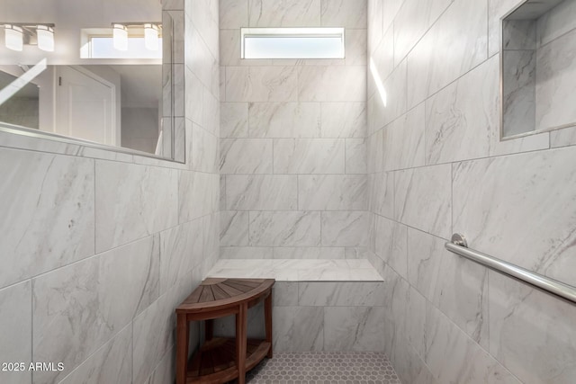 bathroom with a tile shower