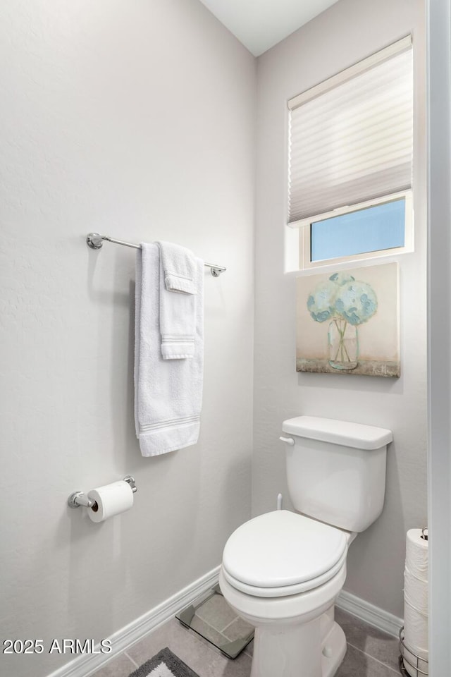 bathroom featuring tile patterned floors and toilet