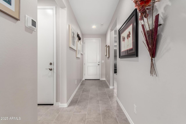 corridor featuring light tile patterned floors