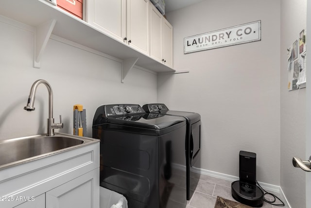 washroom with cabinets, light tile patterned floors, sink, and independent washer and dryer