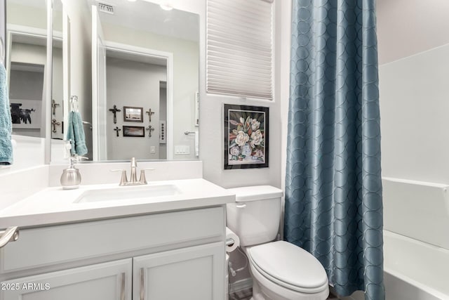 full bathroom with toilet, vanity, and shower / bath combination with curtain