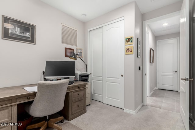 office space with light colored carpet