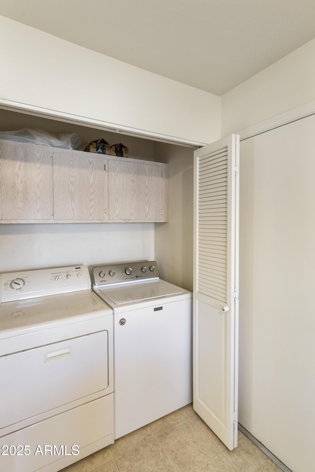 laundry room with washing machine and dryer