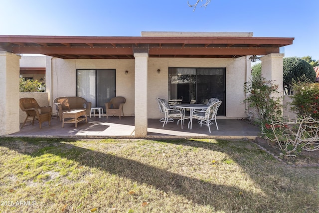 rear view of property with a patio area and a yard