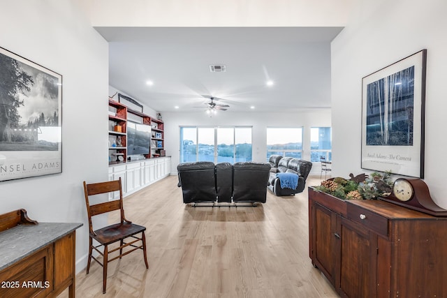 living area with ceiling fan, light wood-style flooring, visible vents, and recessed lighting