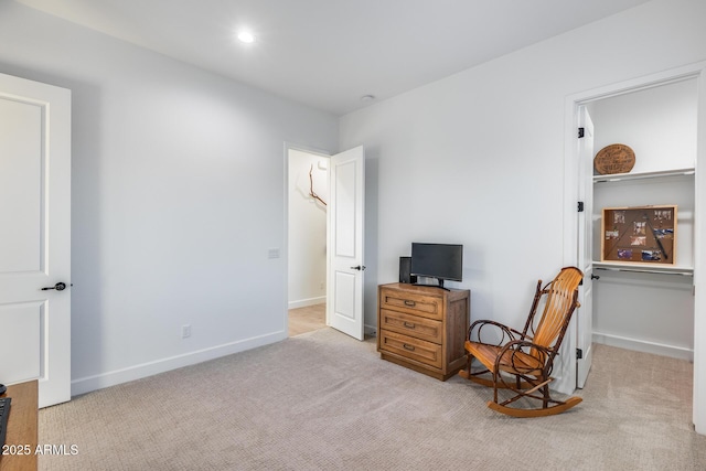 interior space featuring light carpet, recessed lighting, and baseboards