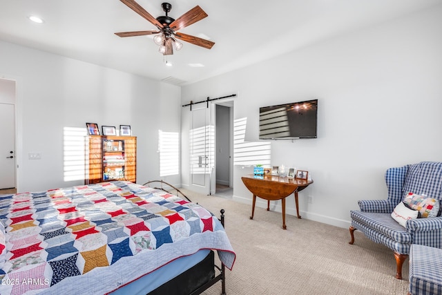 bedroom with recessed lighting, a barn door, a ceiling fan, light carpet, and baseboards