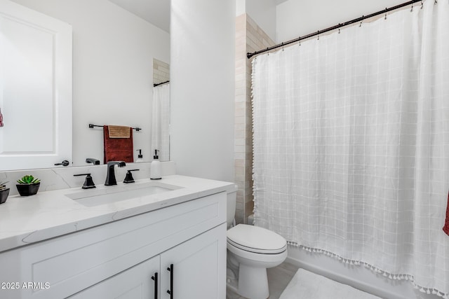 bathroom featuring toilet, shower / bath combination with curtain, and vanity