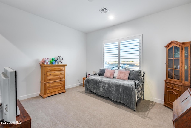 bedroom with light carpet, baseboards, and visible vents