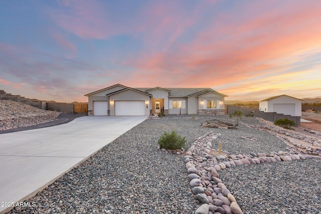 view of front of house featuring a garage and concrete driveway