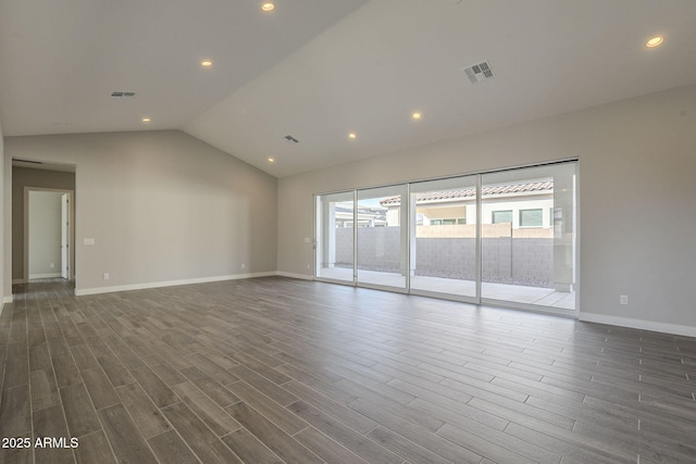 10972 N Hershey St, Surprise, AZ 85388 - unfurnished room featuring dark wood-style flooring, visible vents, and vaulted ceiling