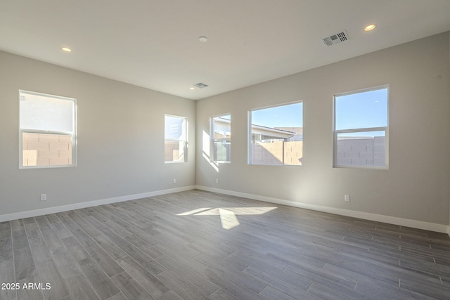 10972 N Hershey St, Surprise, AZ 85388 - unfurnished room with recessed lighting, wood finished floors, visible vents, and baseboards