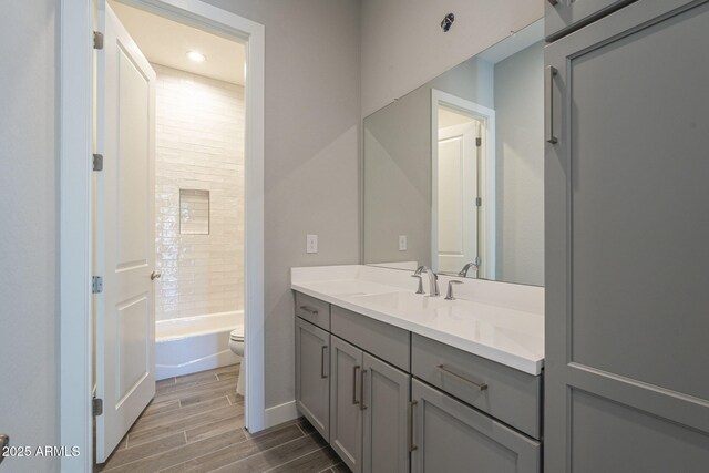10972 N Hershey St, Surprise, AZ 85388 - full bath featuring wood finish floors, vanity, toilet, and bathing tub / shower combination