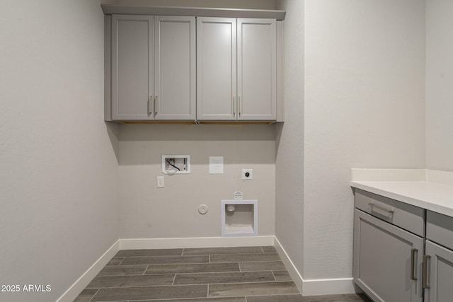 10972 N Hershey St, Surprise, AZ 85388 - clothes washing area featuring cabinet space, wood tiled floor, hookup for an electric dryer, gas dryer hookup, and baseboards