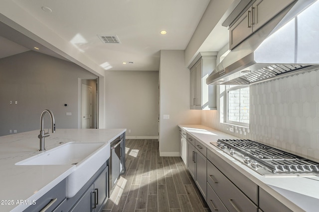 10972 N Hershey St, Surprise, AZ 85388 - kitchen featuring ventilation hood, gray cabinets, a sink, and stainless steel gas stovetop